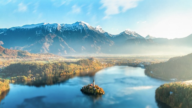 Slovenia with water so reflective the mountains look rehearsed